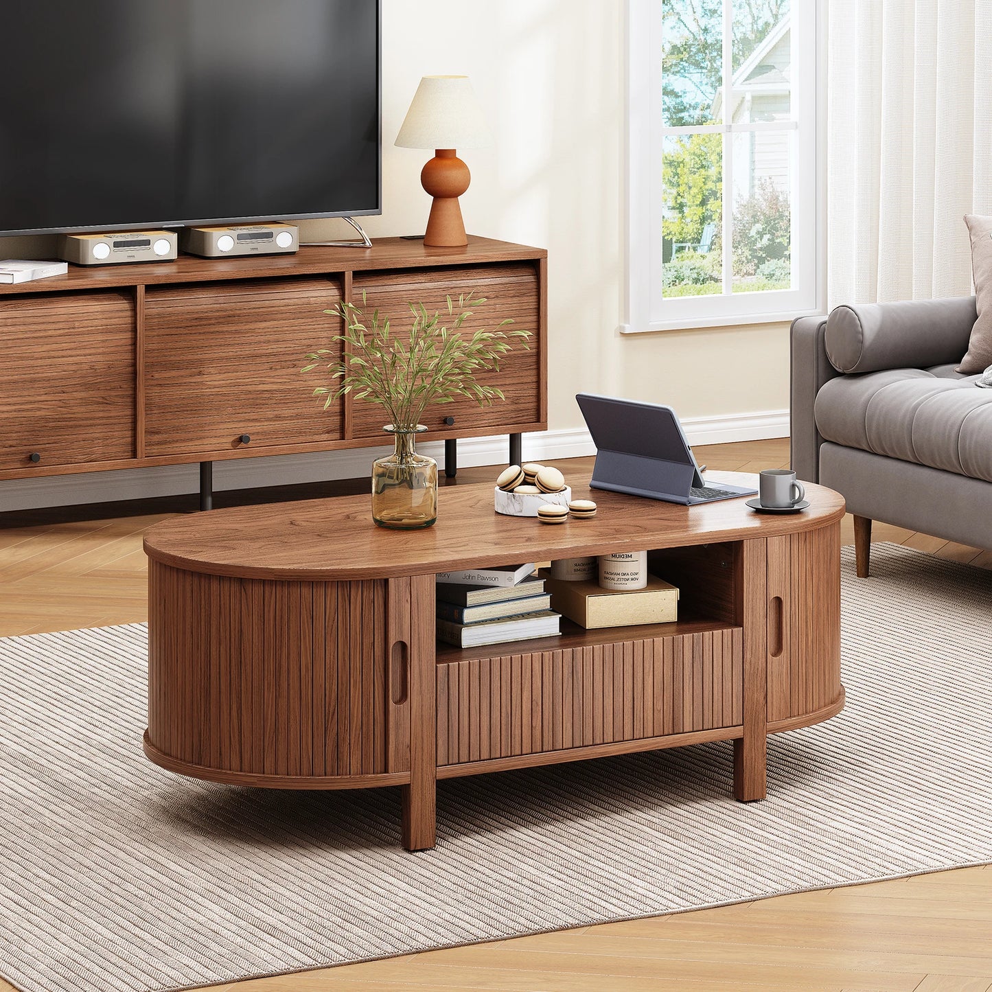 Oval Coffee Table With Storage And Sliding Cabinet Doors